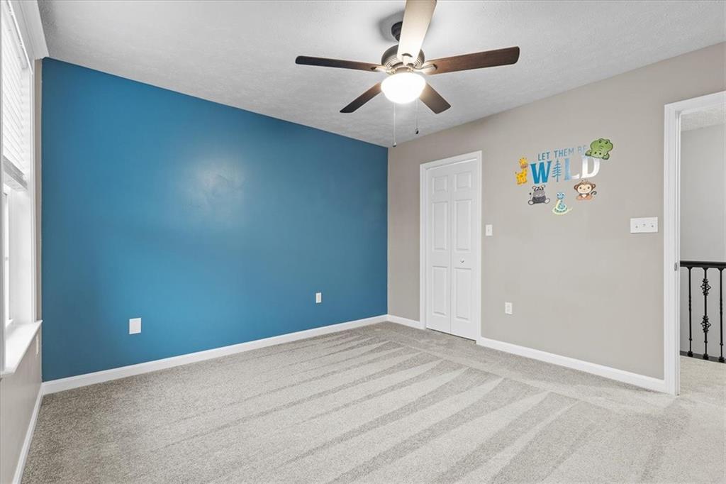 149 Lockheed Drive Coraopolis, PA 15108 - Photo 30 of 48 an empty room with ceiling fan and window