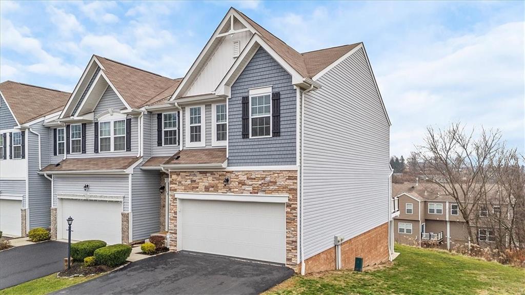 149 Lockheed Drive Coraopolis, PA 15108 - Photo 3 of 48 a front view of a house with a yard and garage