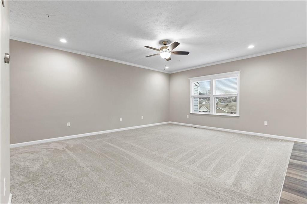 149 Lockheed Drive Coraopolis, PA 15108 - Photo 9 of 48 an empty room with windows and ceiling fan