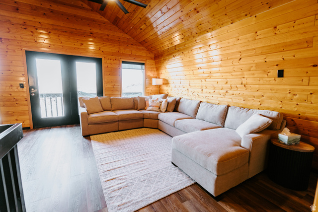 1413 Basel Drive Midway, UT 84049 - Photo 50 of 137 Living room featuring wood walls, wood finished floors, a ceiling fan, and a vaulted wooden ceiling