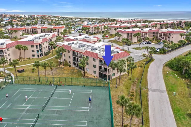 an aerial view of residential houses with outdoor space