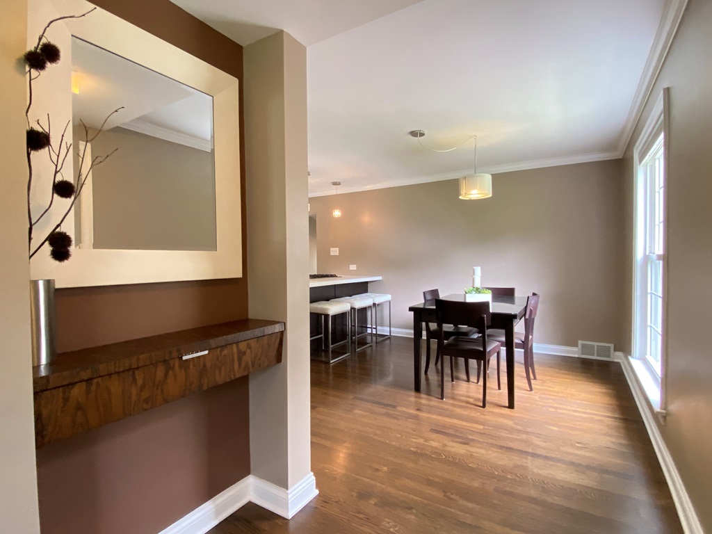 751 Selborne Road Riverside, IL 60546 - Photo 4 of 47 a view of a dining room with furniture and wooden floor
