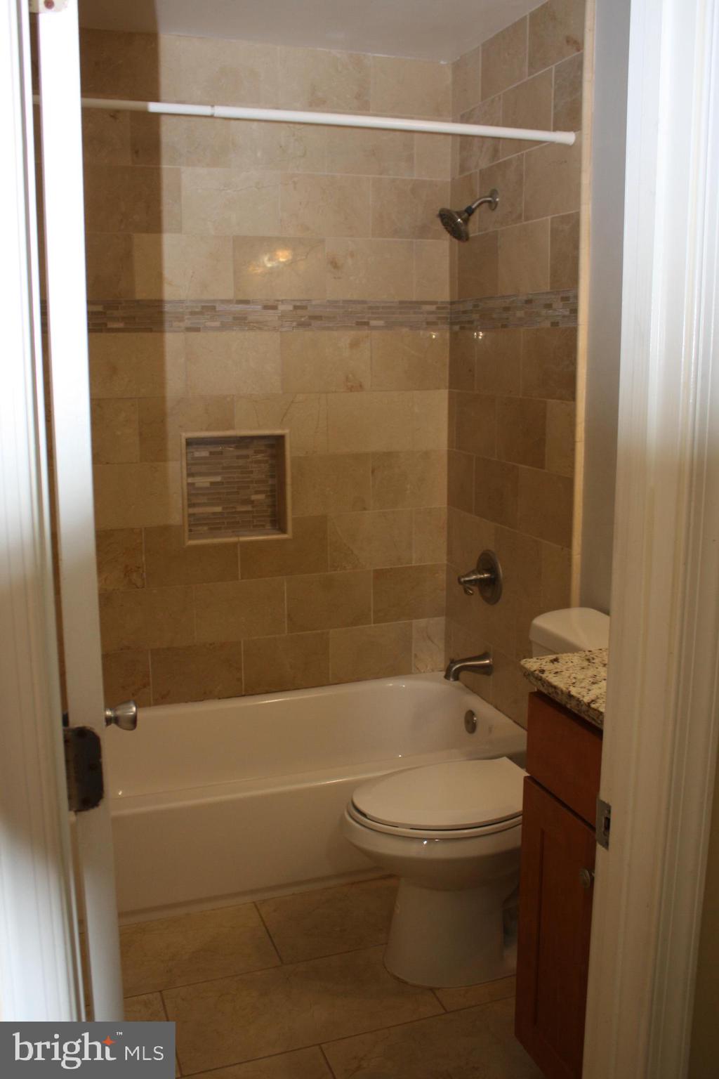 6261 Alforth Avenue Alexandria, VA 22315 - Photo 14 of 29 a bathroom with a toilet and a shower