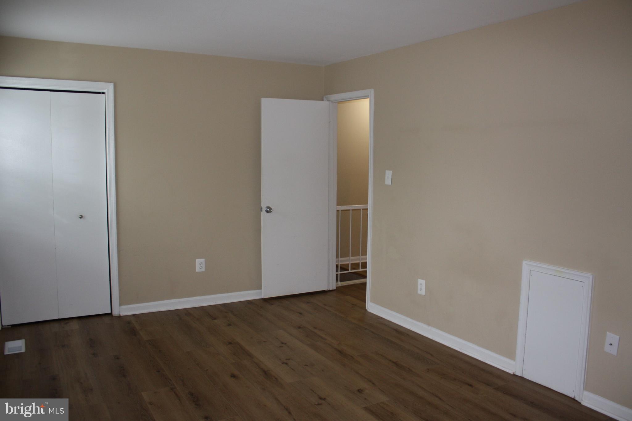 6261 Alforth Avenue Alexandria, VA 22315 - Photo 22 of 29 a view of an empty room with wooden floor