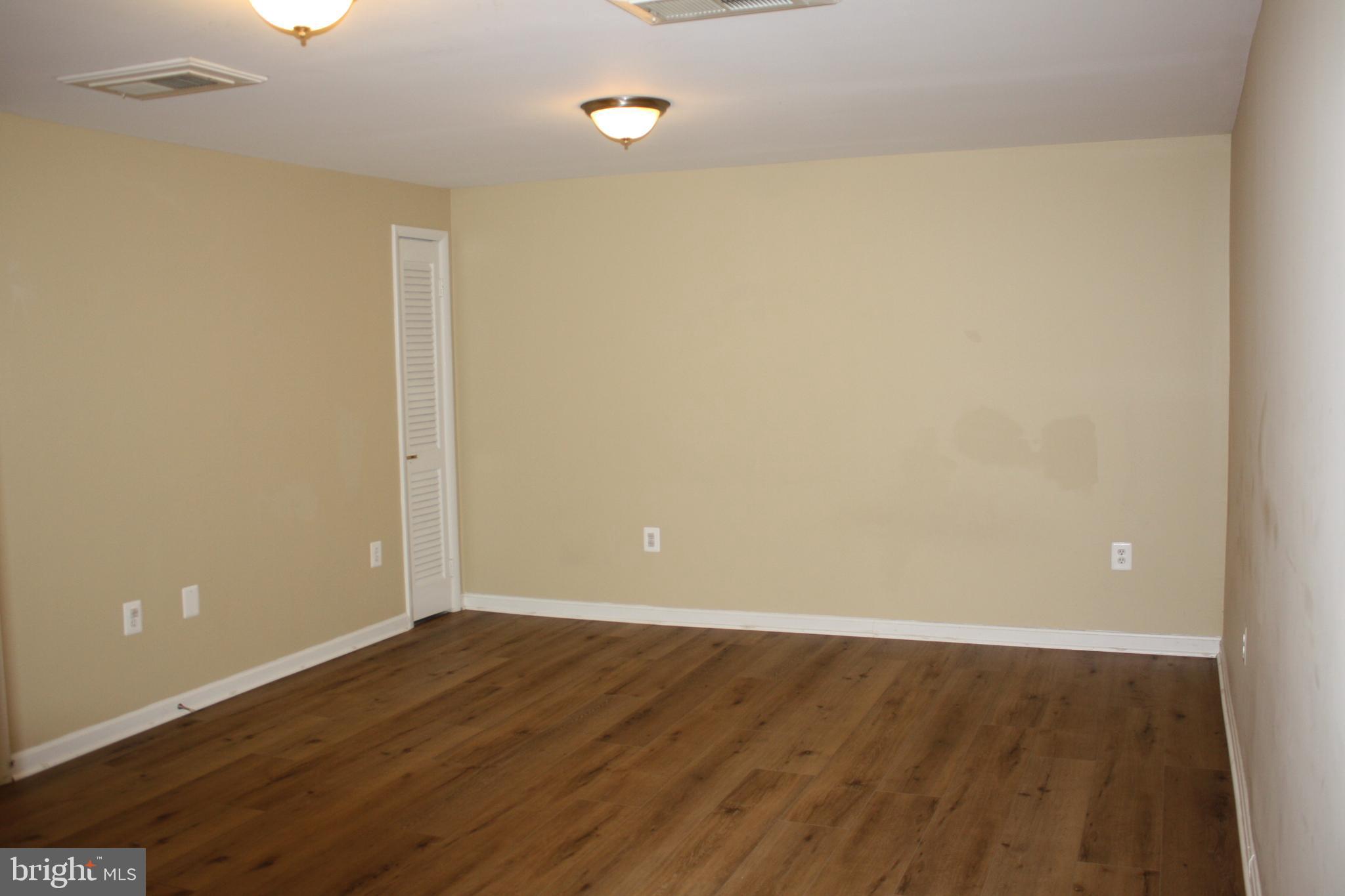 6261 Alforth Avenue Alexandria, VA 22315 - Photo 23 of 29 a view of an empty room with wooden floor