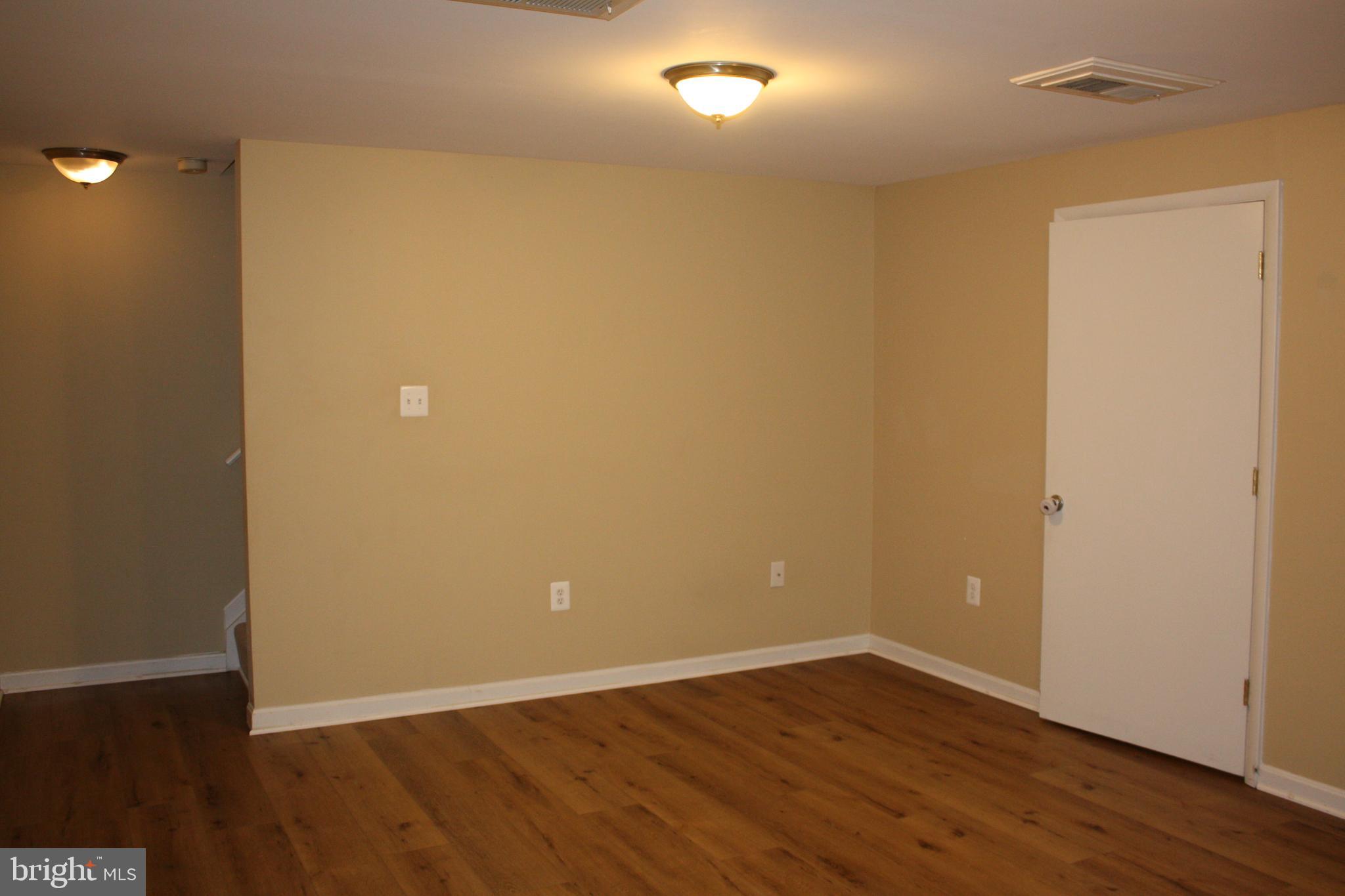 6261 Alforth Avenue Alexandria, VA 22315 - Photo 24 of 29 a view of an empty room with wooden floor