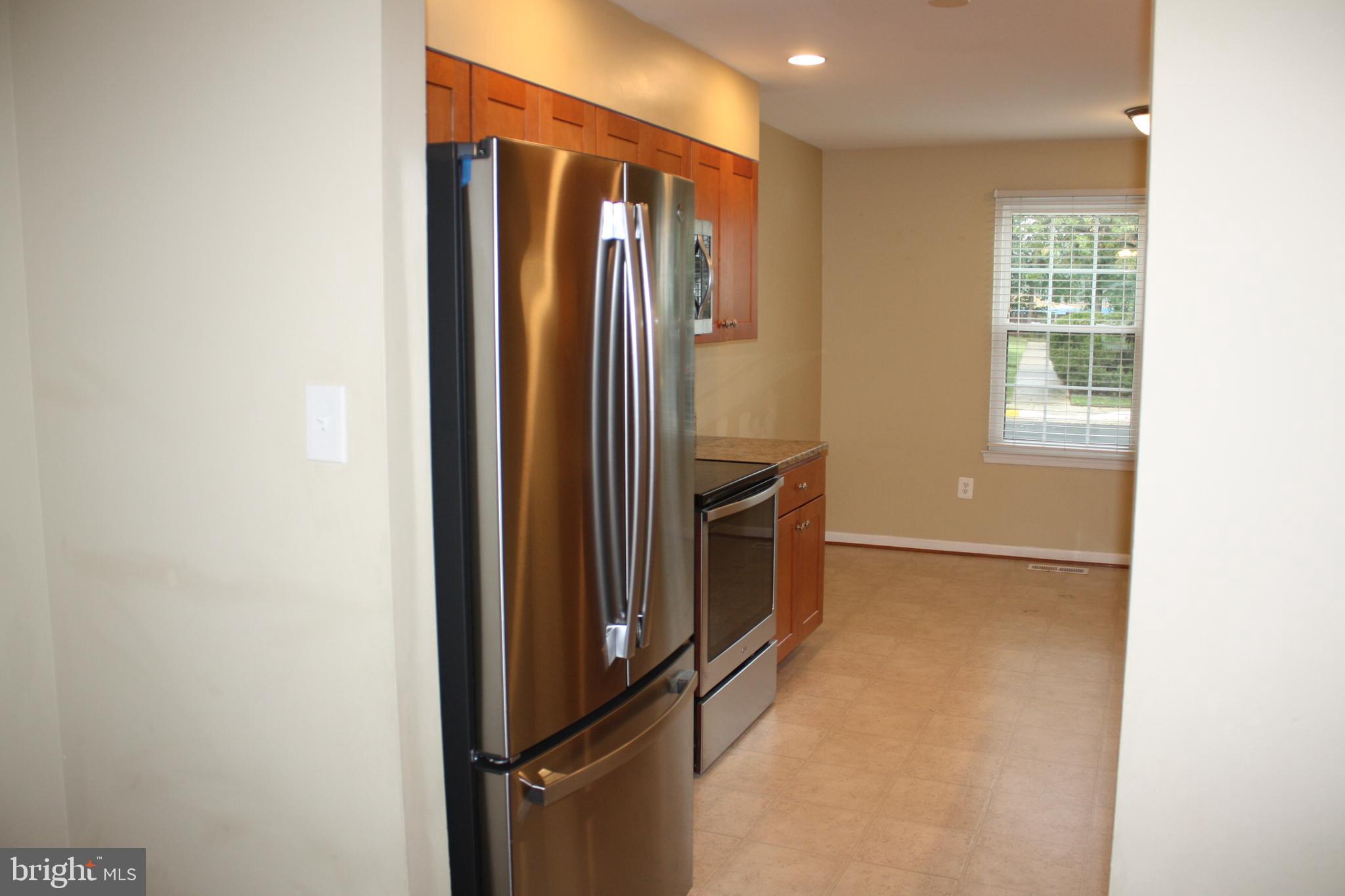 6261 Alforth Avenue Alexandria, VA 22315 - Photo 7 of 29 a view of empty room with windows and refrigerator
