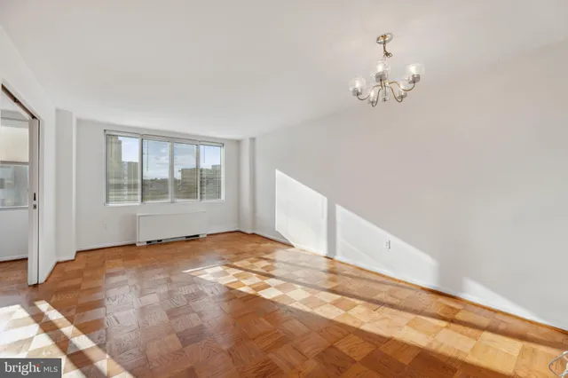 a view of an empty room with a window
