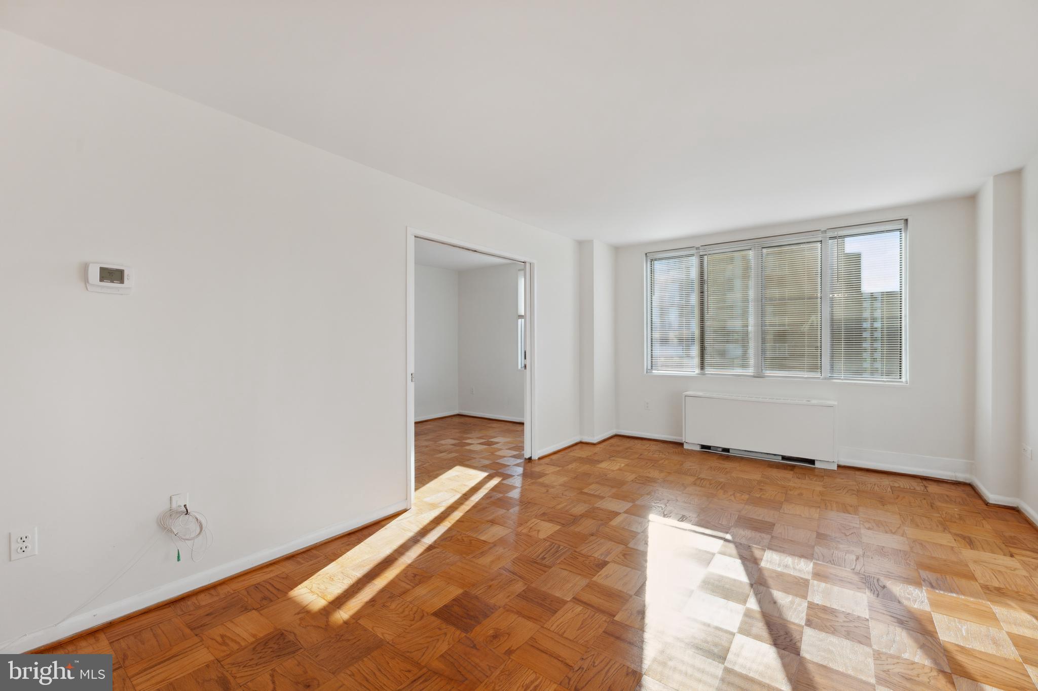 2939 Van Ness Street Northwest, Unit 1243 Washington, DC 20008 - Photo 12 of 33 a view of an empty room with a window