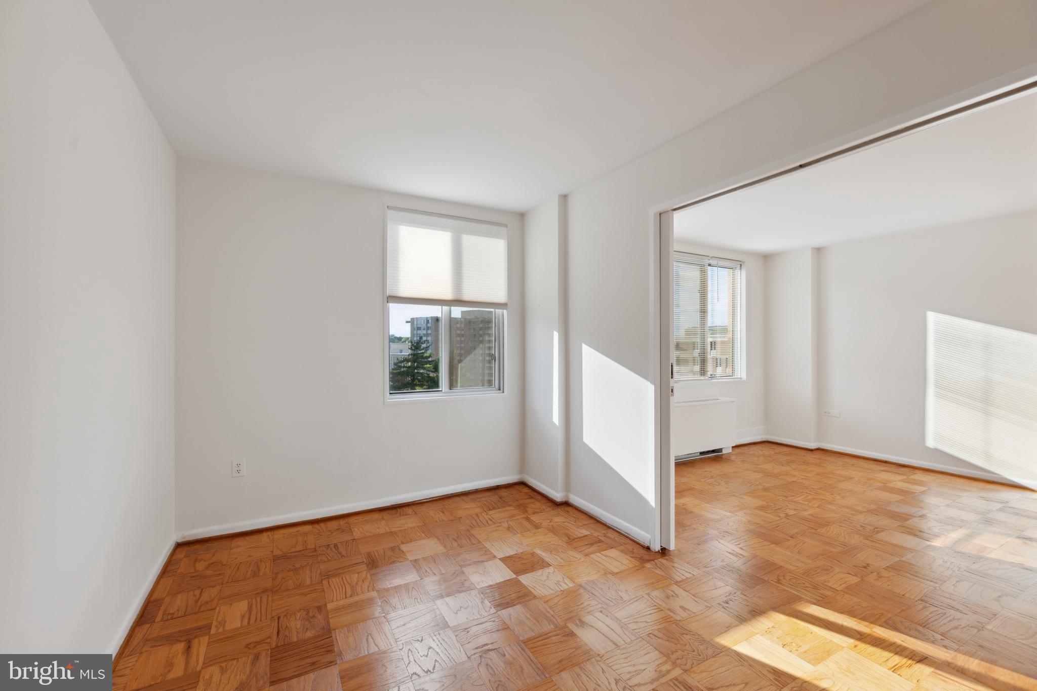 2939 Van Ness Street Northwest, Unit 1243 Washington, DC 20008 - Photo 14 of 33 an empty room with windows