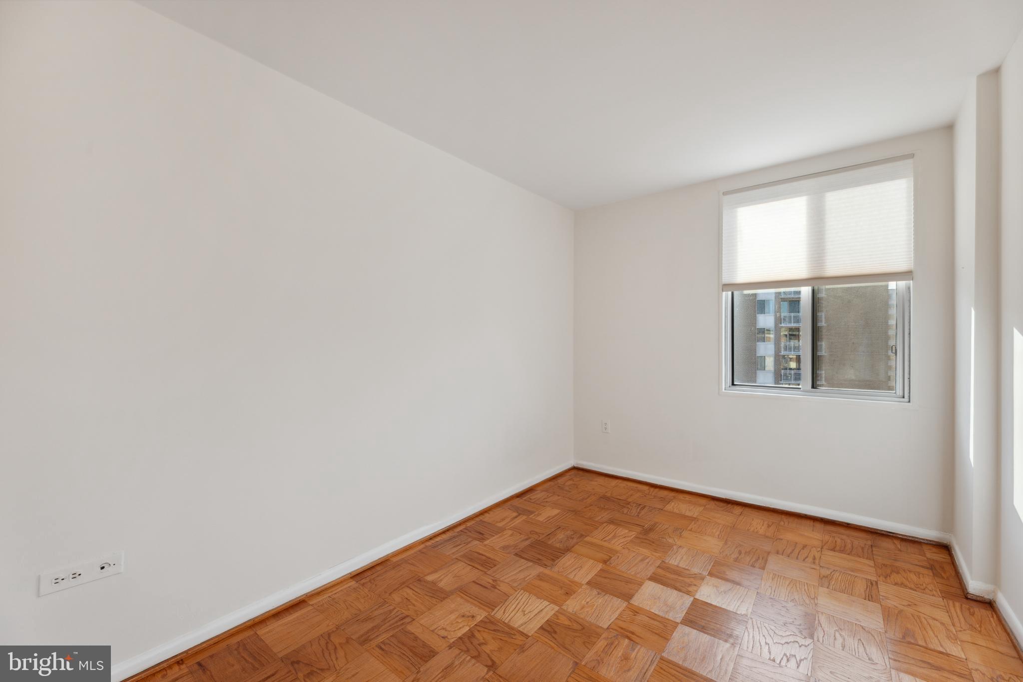 2939 Van Ness Street Northwest, Unit 1243 Washington, DC 20008 - Photo 16 of 33 an empty room with a window
