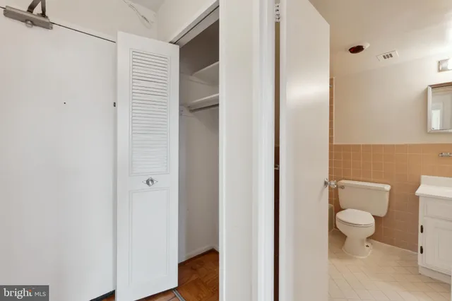 a bathroom with a sink mirror toilet and bathtub
