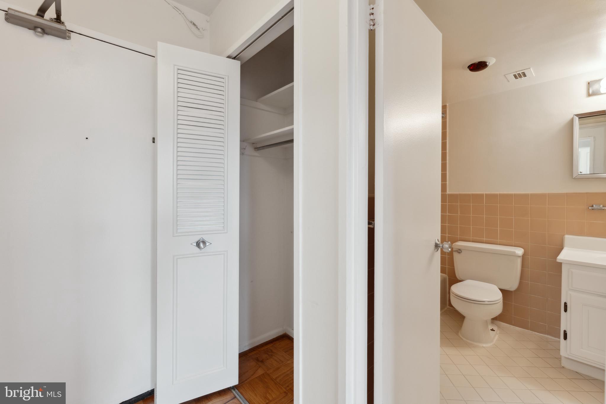 2939 Van Ness Street Northwest, Unit 1243 Washington, DC 20008 - Photo 21 of 33 a bathroom with a toilet and a sink