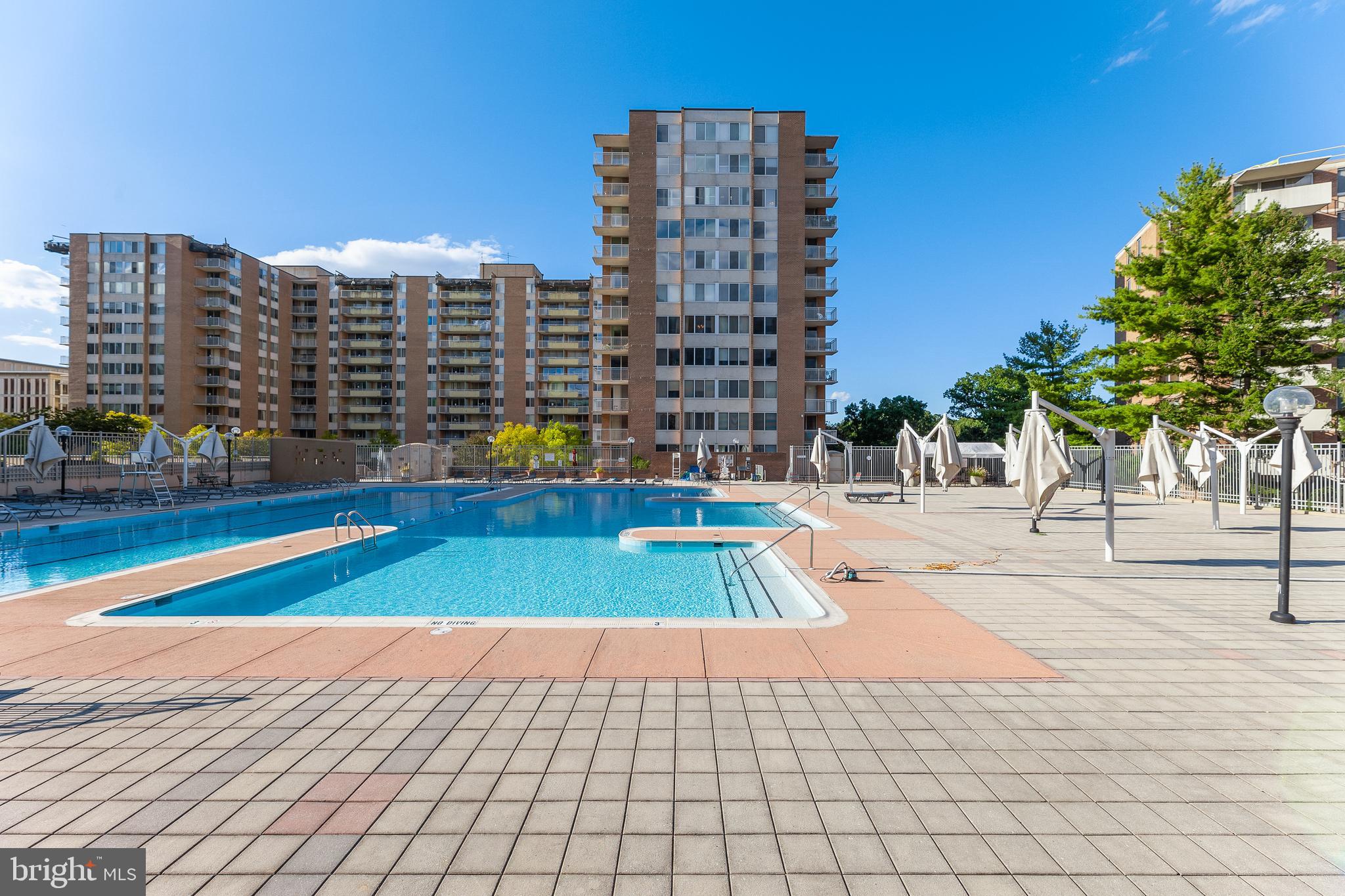 2939 Van Ness Street Northwest, Unit 1243 Washington, DC 20008 - Photo 29 of 33 a view of outdoor space with swimming pool and tall buildings
