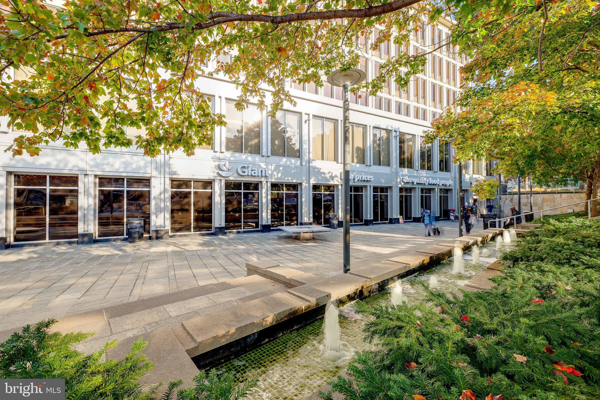 2939 Van Ness Street Northwest, Unit 1243 Washington, DC 20008 - Photo 32 of 33 front view of a house with a yard