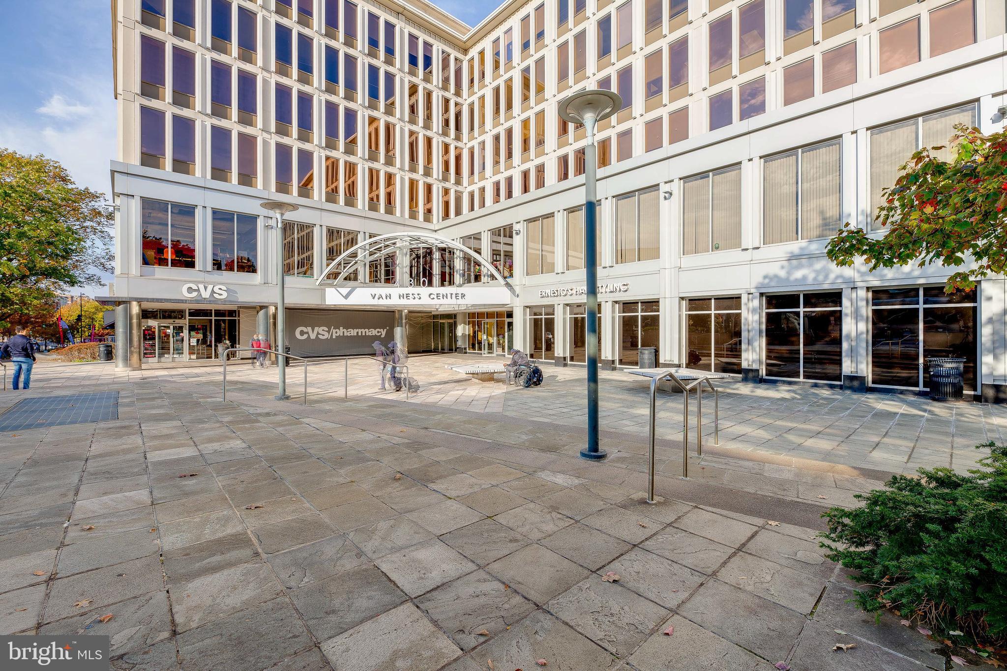 2939 Van Ness Street Northwest, Unit 1243 Washington, DC 20008 - Photo 33 of 33 front view of a building with a bench