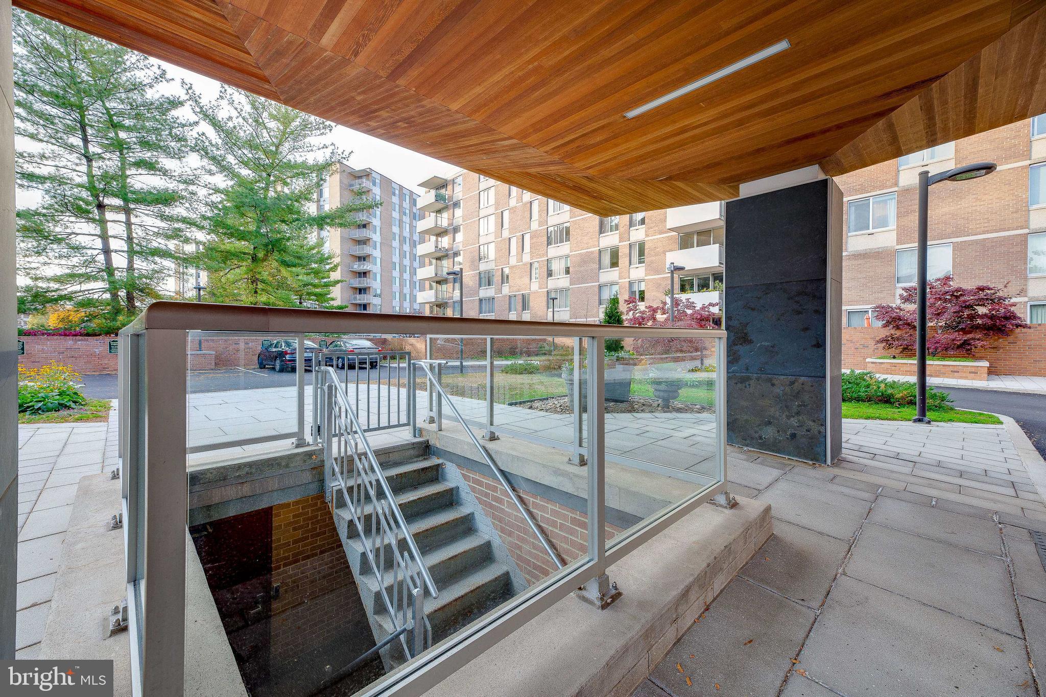 2939 Van Ness Street Northwest, Unit 1243 Washington, DC 20008 - Photo 4 of 33 a view of a deck with wooden floor and wooden fence