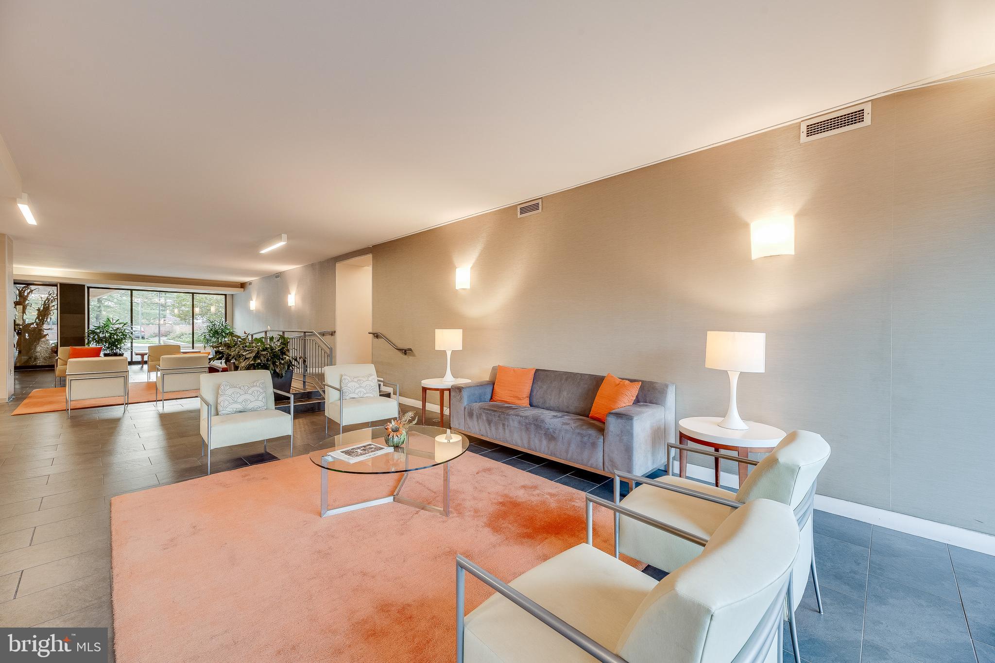 2939 Van Ness Street Northwest, Unit 1243 Washington, DC 20008 - Photo 7 of 33 a living room with furniture and a wooden floor