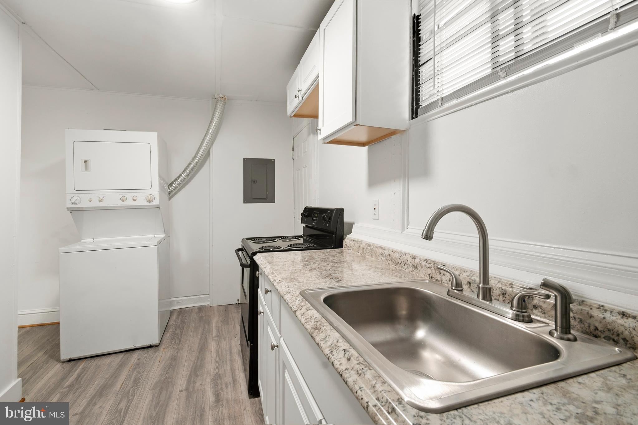 2008 Division Street Baltimore, MD 21217 - Photo 11 of 21 a kitchen with a sink and a stove top oven