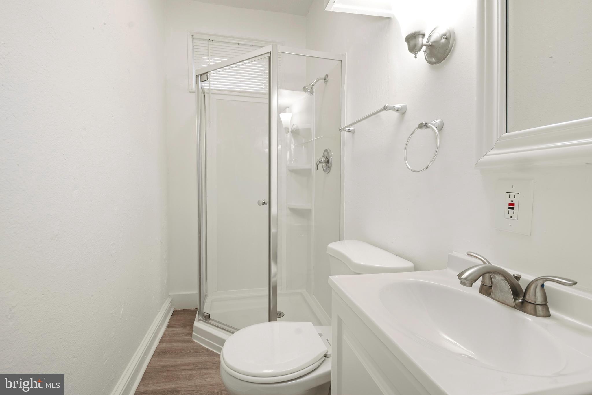 2008 Division Street Baltimore, MD 21217 - Photo 13 of 21 a bathroom with a sink a toilet and shower