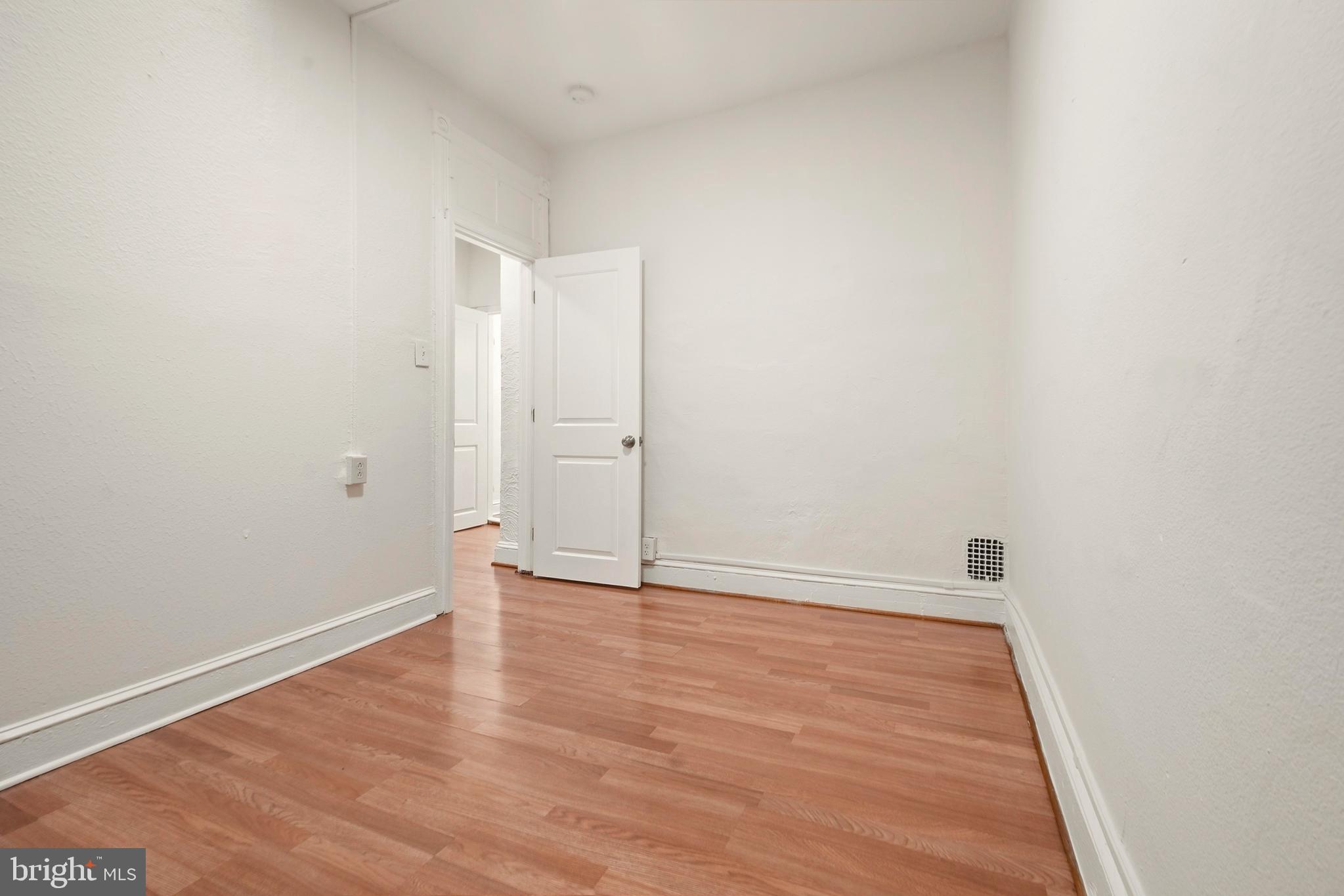 2008 Division Street Baltimore, MD 21217 - Photo 18 of 21 a view of an empty room with wooden floor
