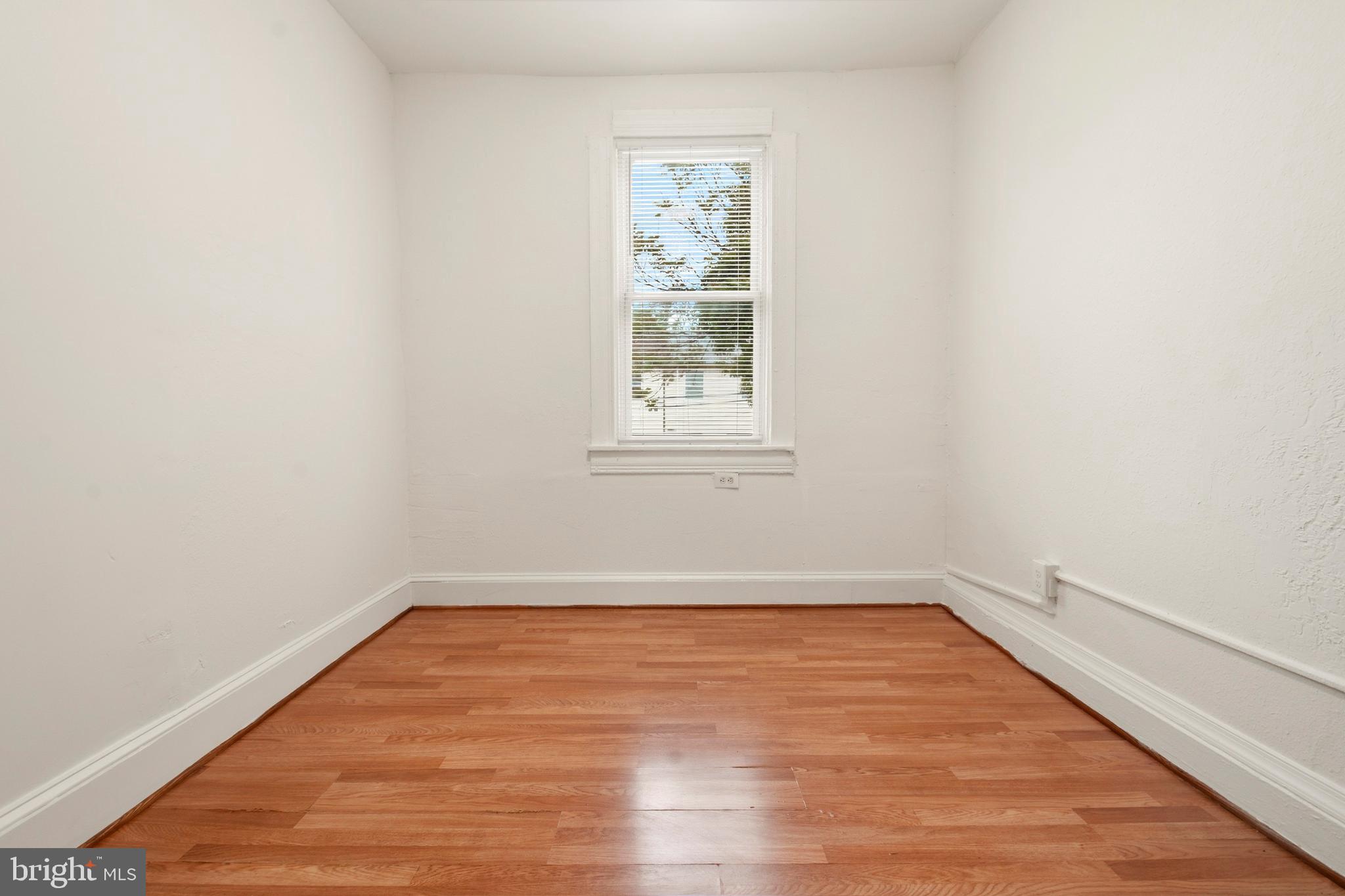 2008 Division Street Baltimore, MD 21217 - Photo 19 of 21 a view of a room with wooden floor and window