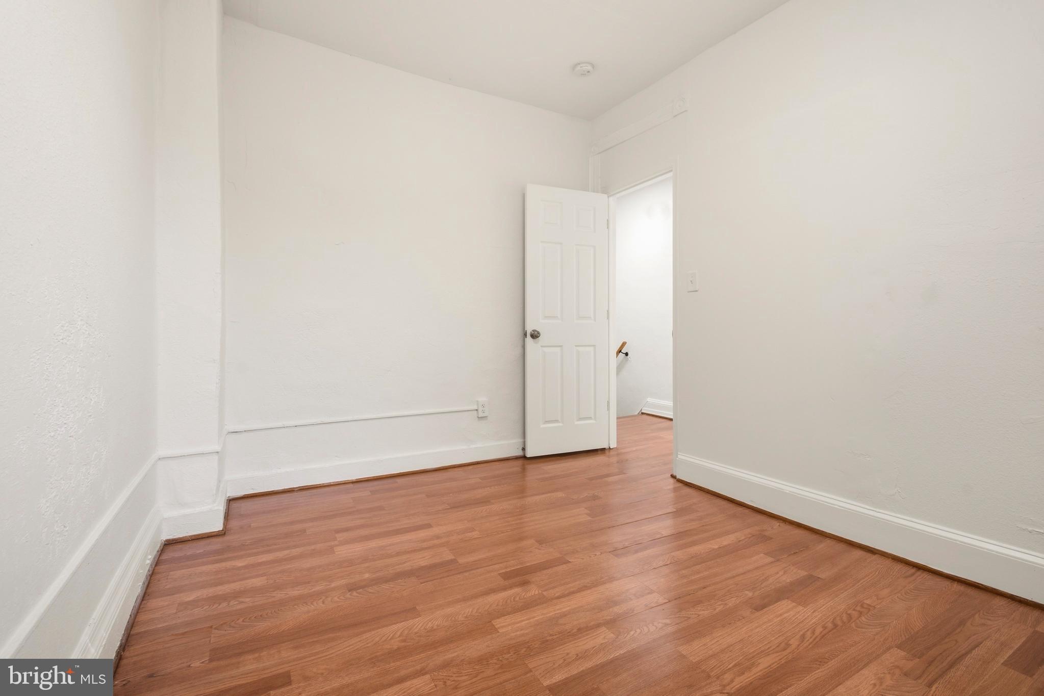 2008 Division Street Baltimore, MD 21217 - Photo 20 of 21 an empty room with wooden floor