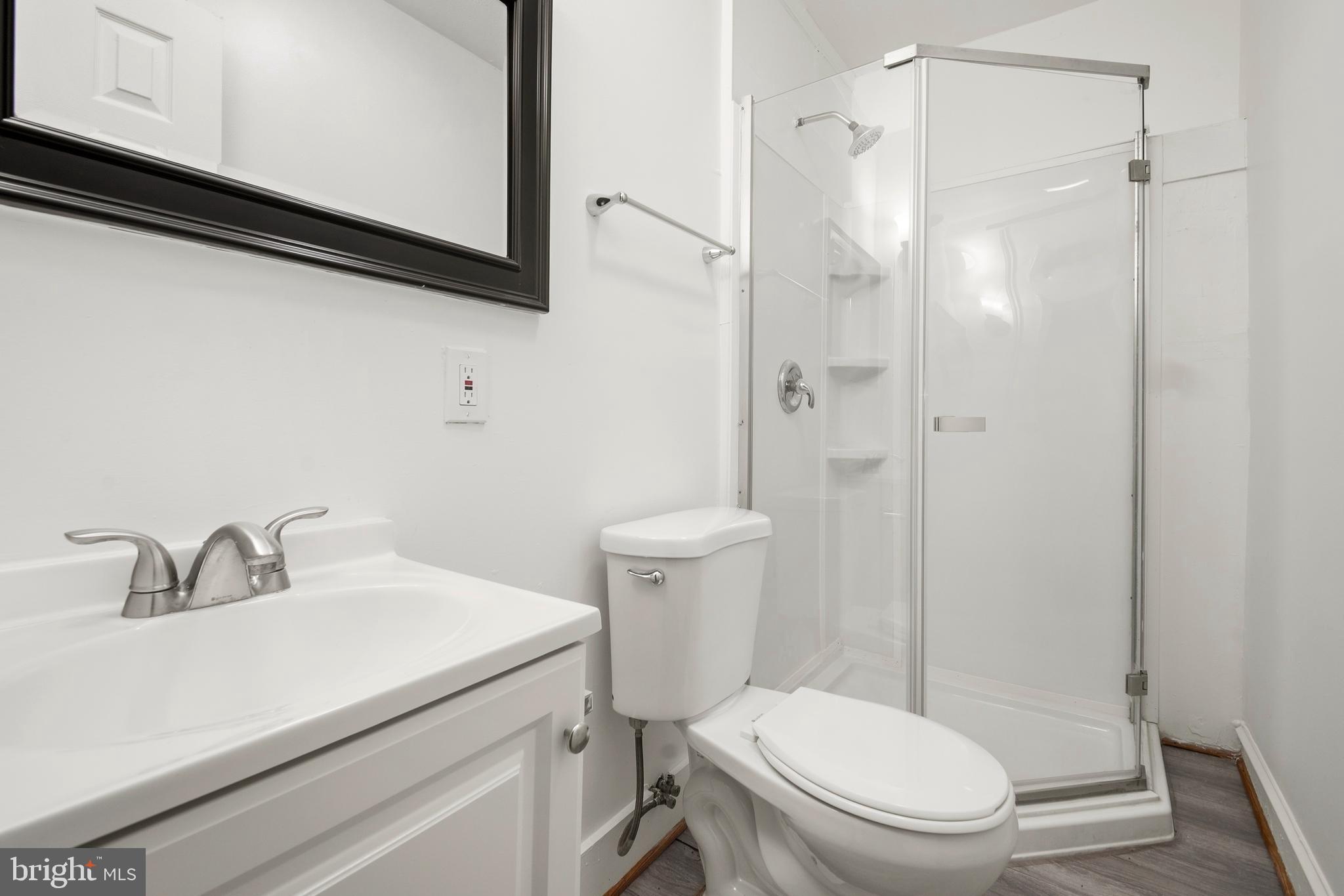 2008 Division Street Baltimore, MD 21217 - Photo 8 of 21 a bathroom with a sink a toilet and shower