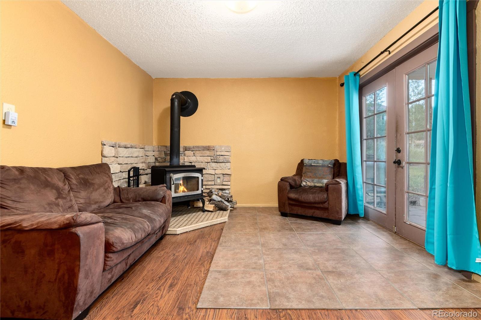 65 Silver Springs Road Bailey, CO 80421 - Photo 21 of 45 a living room with furniture and a large window
