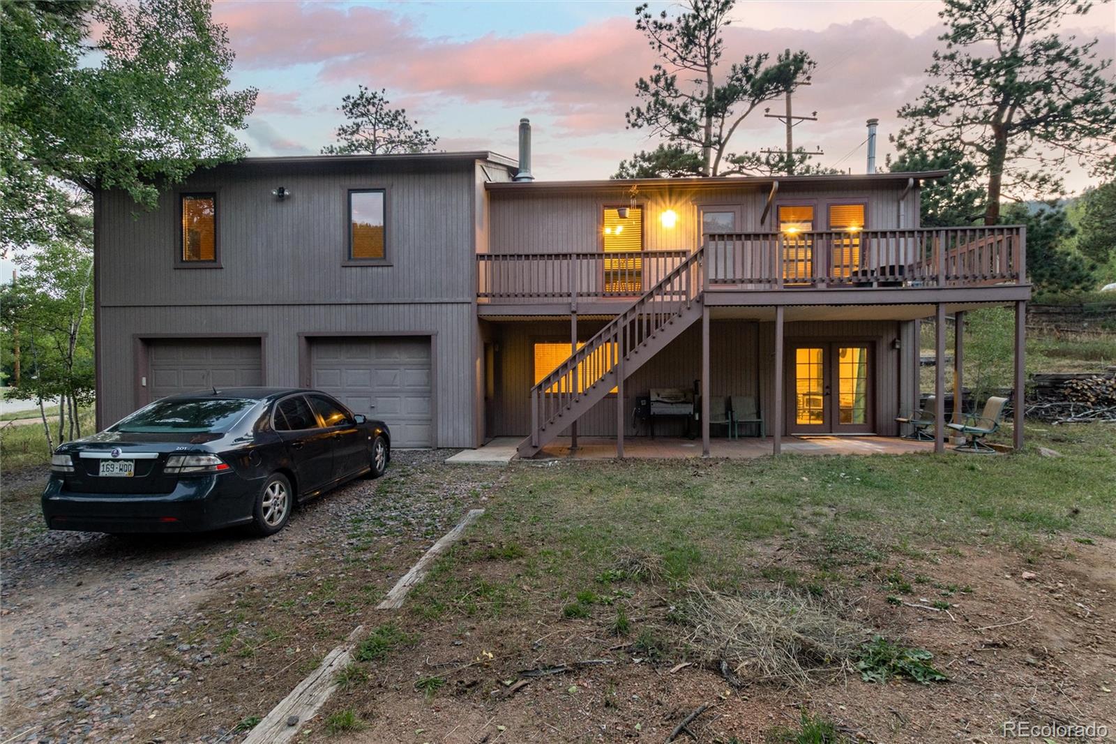 65 Silver Springs Road Bailey, CO 80421 - Photo 30 of 45 a car parked in front of a house