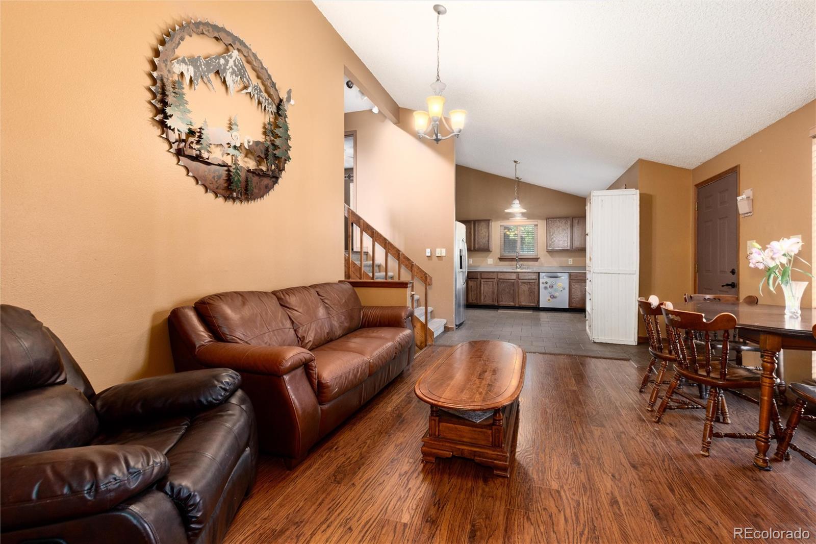 65 Silver Springs Road Bailey, CO 80421 - Photo 4 of 38 a living room with furniture and kitchen view