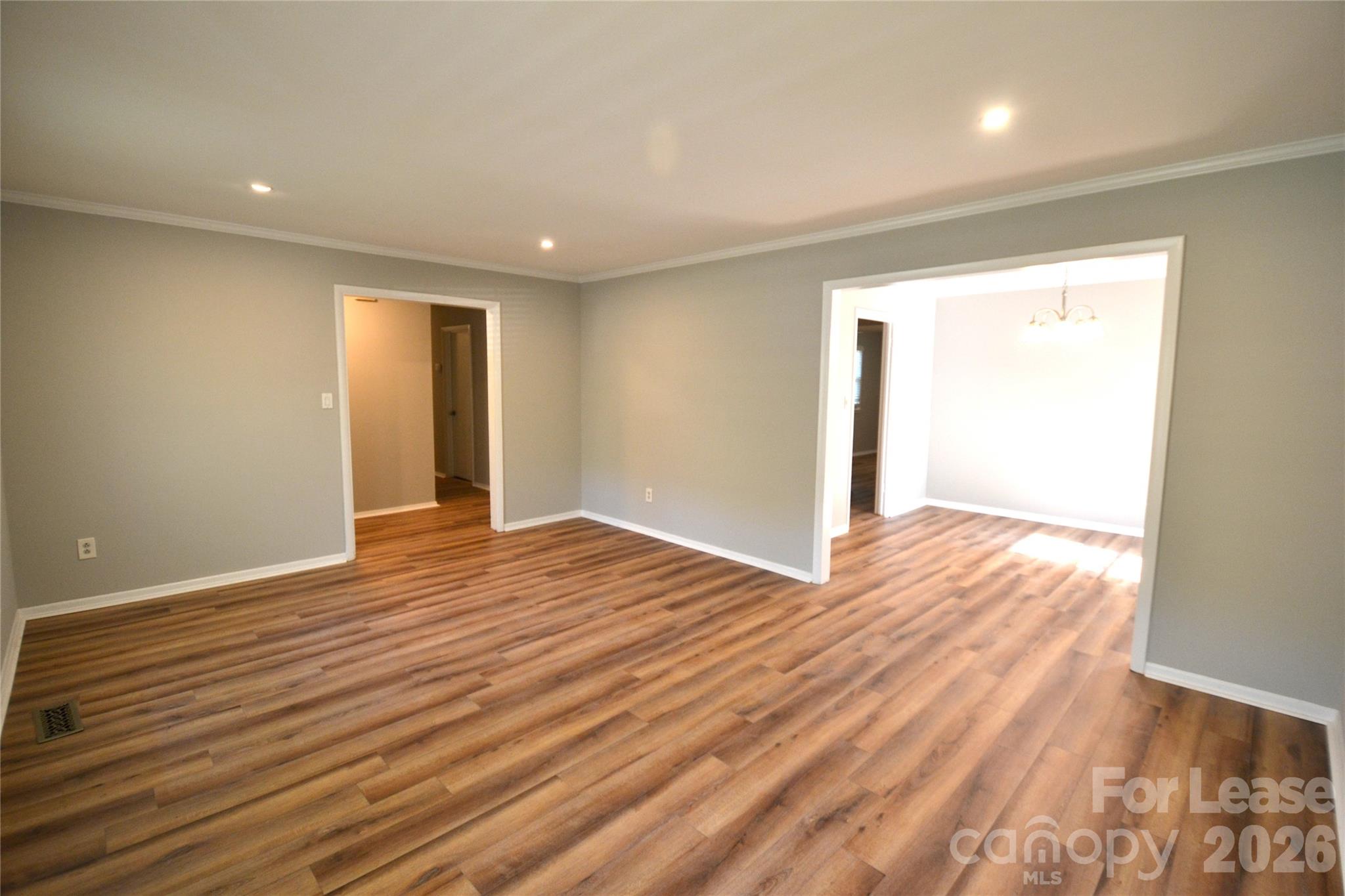 1422 Thermal Road Charlotte, NC 28212 - Photo 4 of 40 a view of an empty room with wooden floor and closet