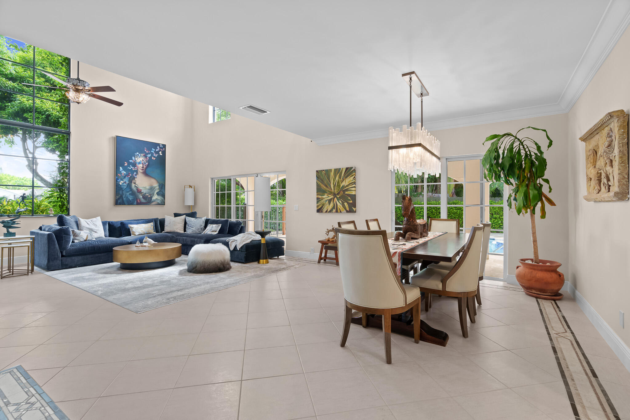 23397 Lago Mar Circle Boca Raton, FL 33433 - Photo 17 of 70 a living room with furniture a chandelier and a large window