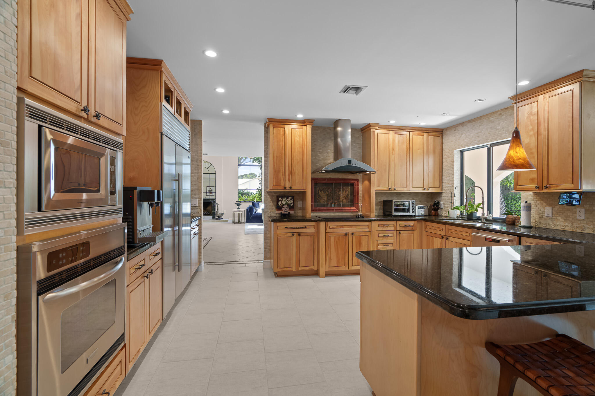 23397 Lago Mar Circle Boca Raton, FL 33433 - Photo 21 of 70 a kitchen with stainless steel appliances granite countertop a stove a sink and a refrigerator