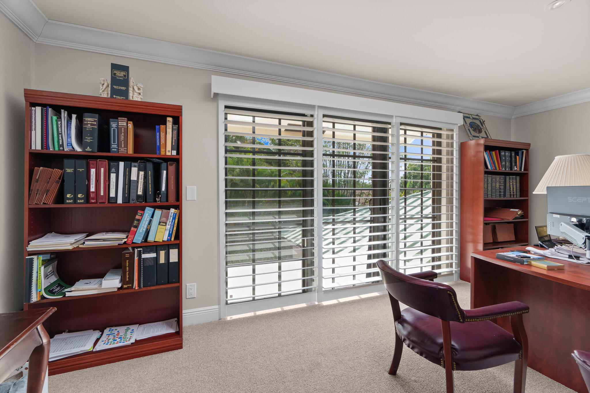 23397 Lago Mar Circle Boca Raton, FL 33433 - Photo 32 of 70 a living room with furniture and a bookshelf
