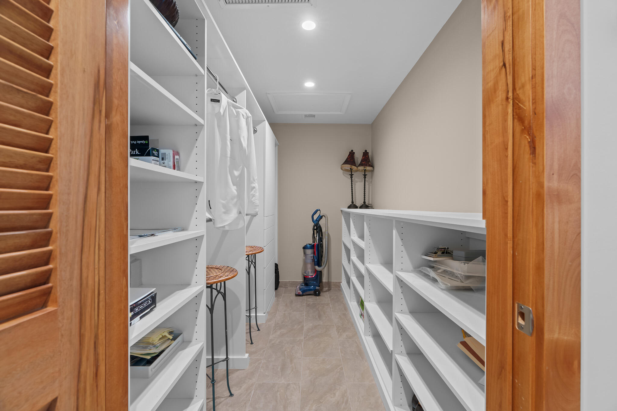 23397 Lago Mar Circle Boca Raton, FL 33433 - Photo 39 of 70 a view of walk in closet with clothes and shoes