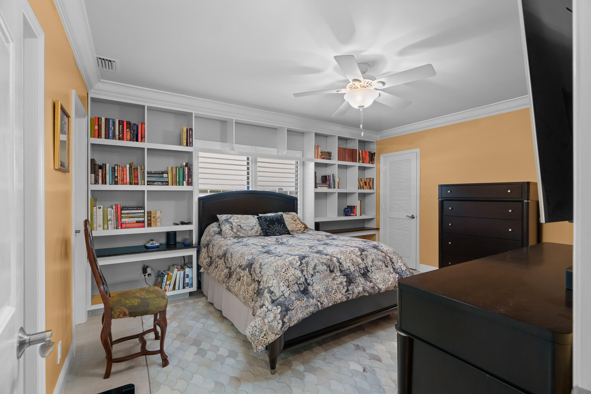23397 Lago Mar Circle Boca Raton, FL 33433 - Photo 40 of 70 a bedroom with a bed and a bookshelf