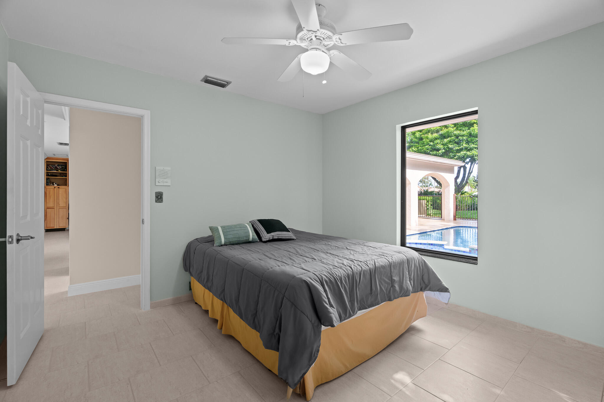 23397 Lago Mar Circle Boca Raton, FL 33433 - Photo 43 of 70 a bedroom with a bed and a window