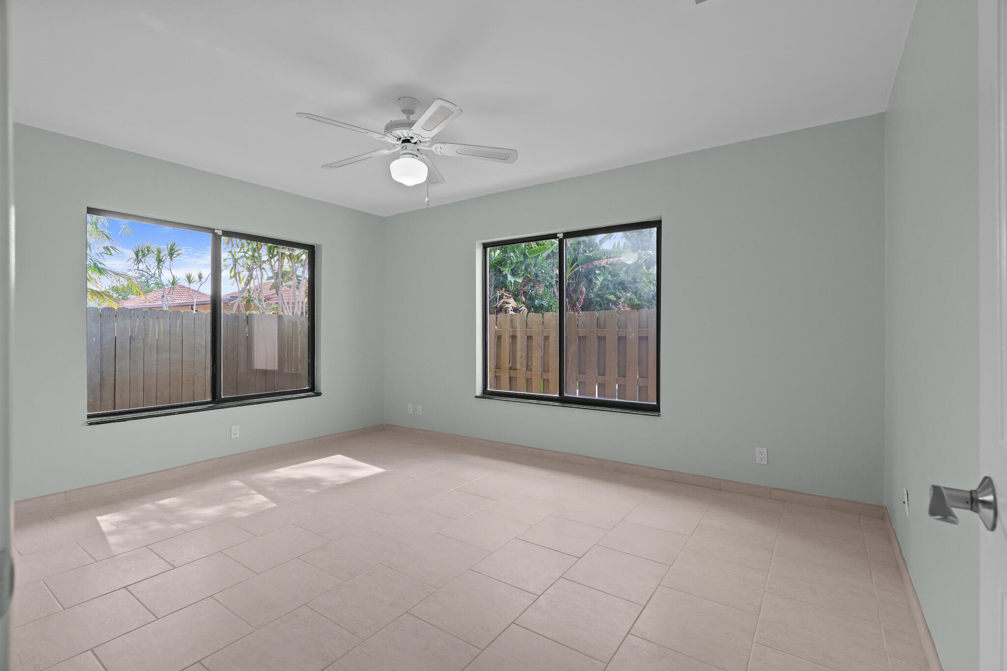 23397 Lago Mar Circle Boca Raton, FL 33433 - Photo 45 of 70 an empty room with windows and fan