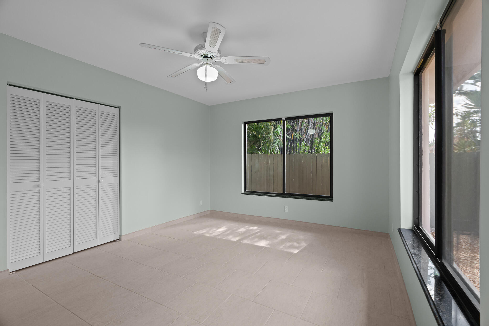 23397 Lago Mar Circle Boca Raton, FL 33433 - Photo 46 of 70 a view of an empty room with windows
