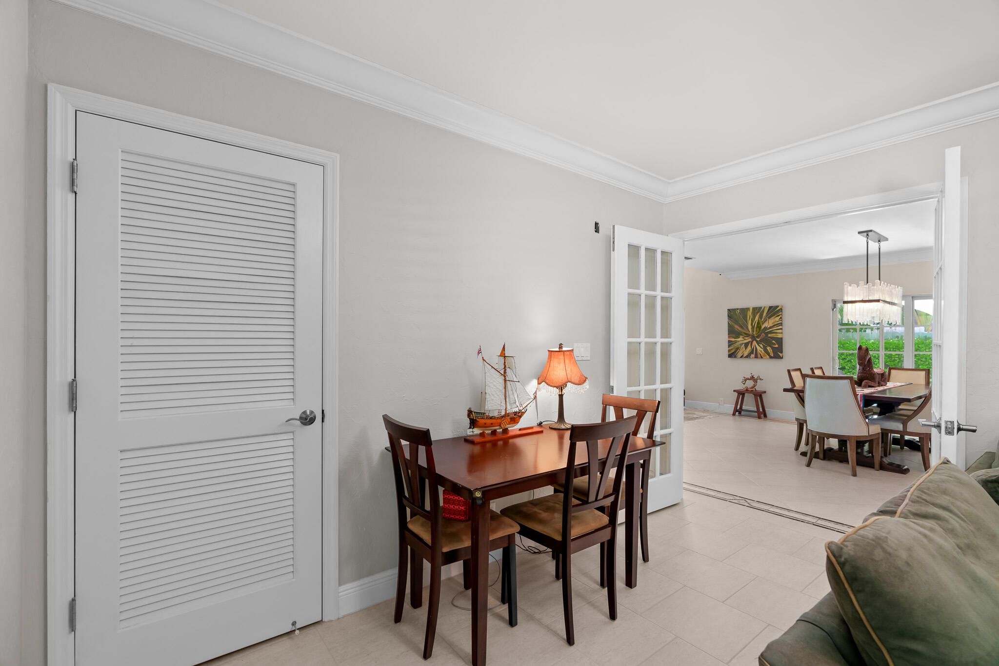 23397 Lago Mar Circle Boca Raton, FL 33433 - Photo 49 of 70 a view of a dining room with furniture and a potted plant