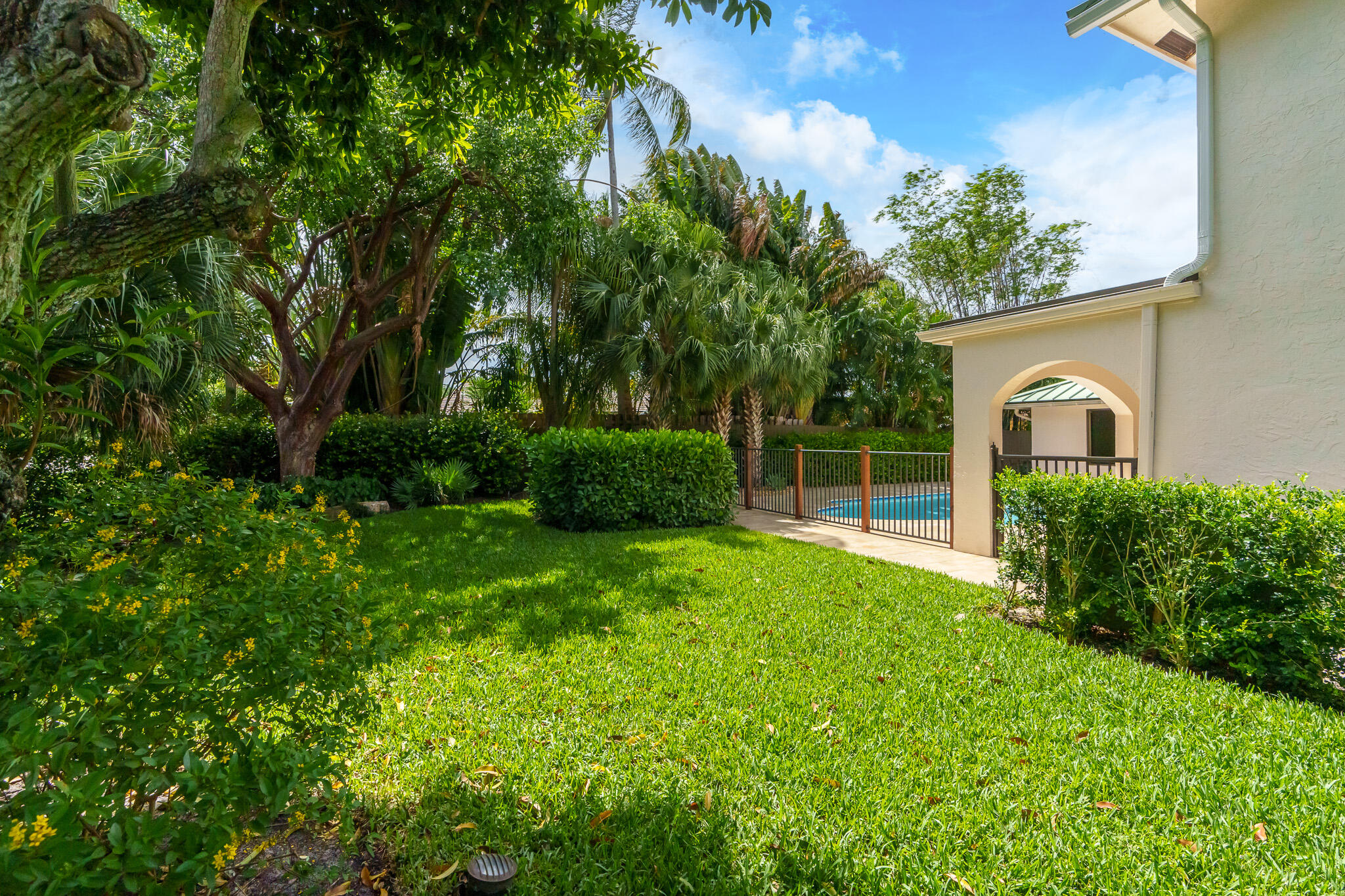 23397 Lago Mar Circle Boca Raton, FL 33433 - Photo 64 of 70 a view of backyard of house with green space
