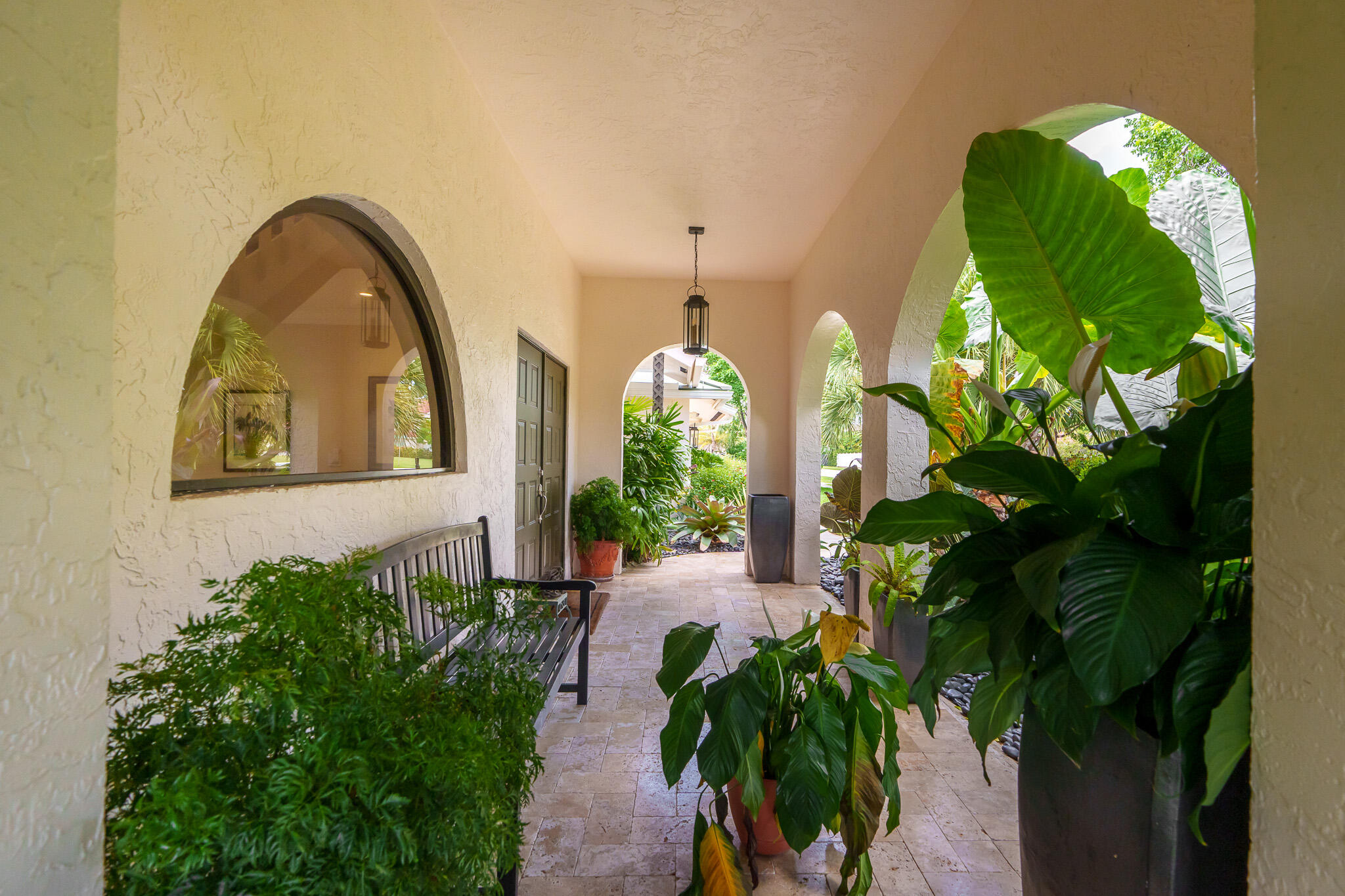 23397 Lago Mar Circle Boca Raton, FL 33433 - Photo 7 of 70 a vase with flowers sitting on a floor in front of a house