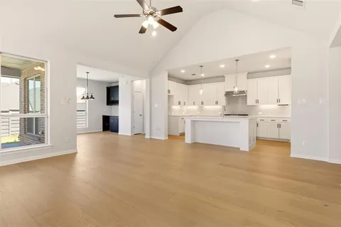 a view of a kitchen with a sink and a window
