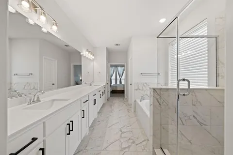 a bathroom with a double vanity sink and a mirror