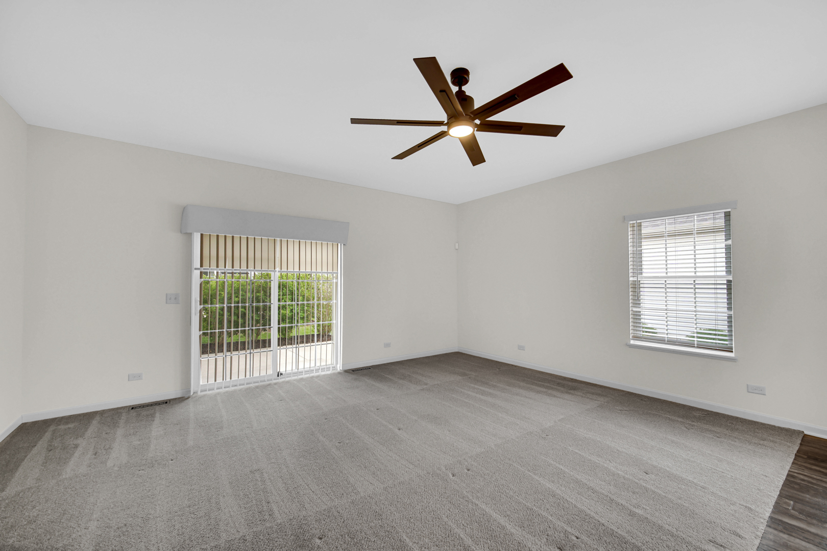 925 Baltimore Street McHenry, IL 60050 - Photo 13 of 27 a view of a big room with wooden floor and windows