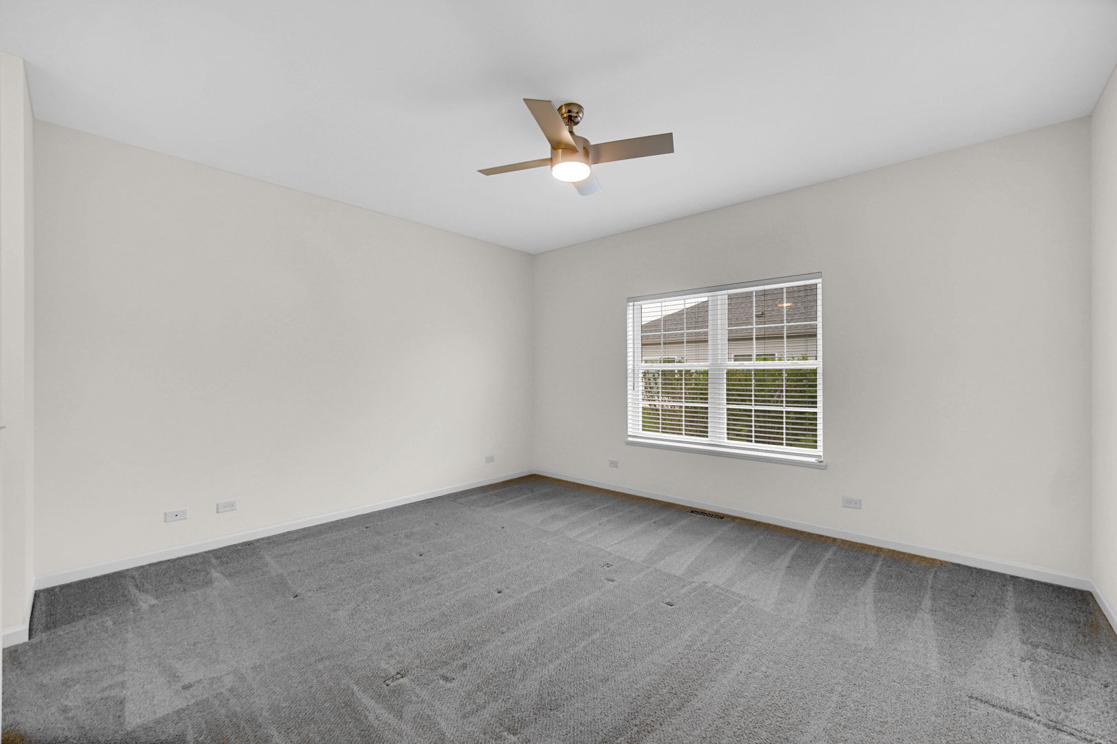 925 Baltimore Street McHenry, IL 60050 - Photo 14 of 27 an empty room with wooden floor and windows