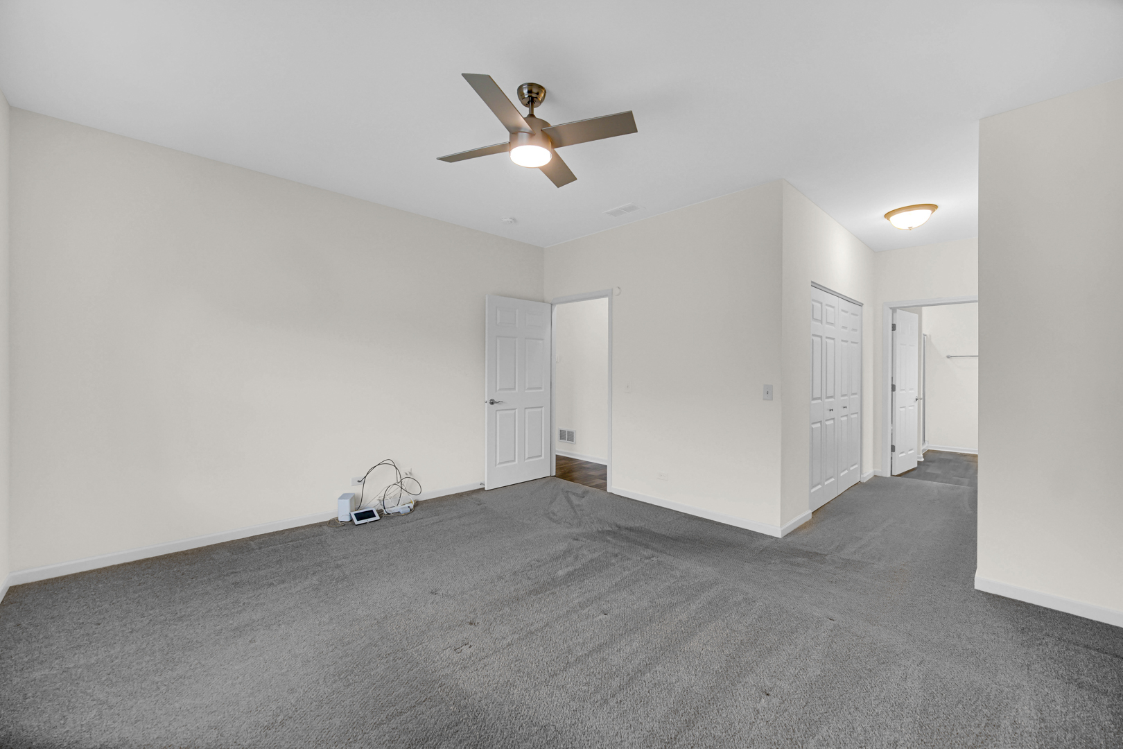 925 Baltimore Street McHenry, IL 60050 - Photo 15 of 27 an empty room with closet and ceiling fan