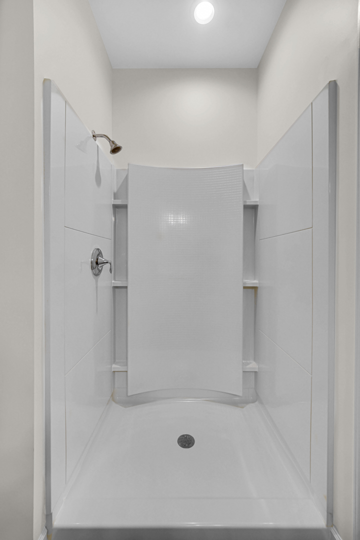 925 Baltimore Street McHenry, IL 60050 - Photo 20 of 27 a bathroom with a shower