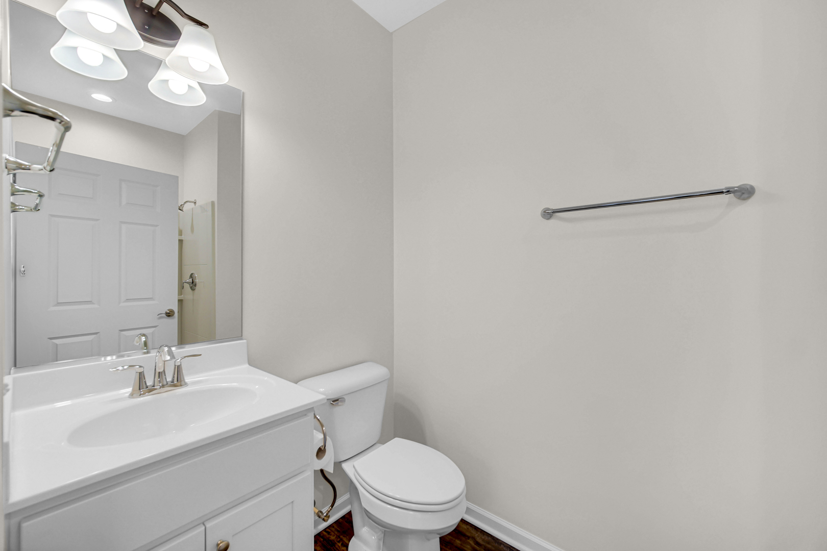 925 Baltimore Street McHenry, IL 60050 - Photo 22 of 27 a bathroom with a sink vanity mirror and toilet